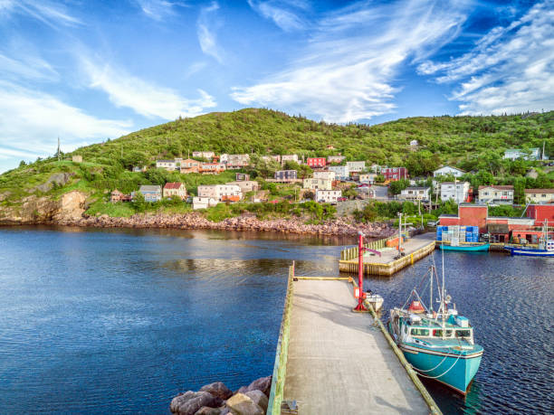 istock Petty Harbour with two piers during summer sunset, Newfoundland, Canada 829540956