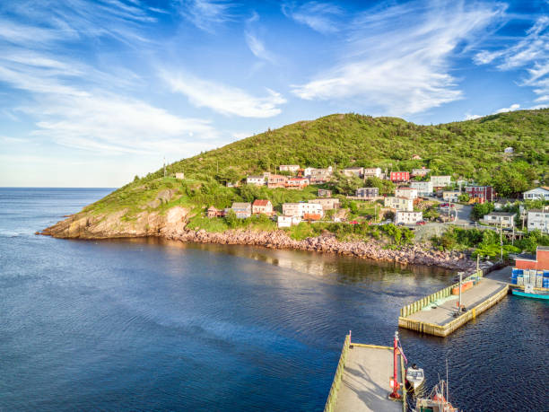 istock Petty Harbour with two piers during summer sunset, Newfoundland, Canada 829540992
