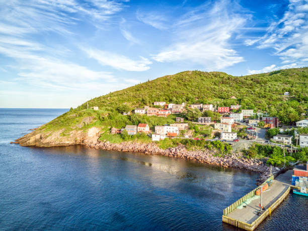 istock Petty Harbour with two piers during summer sunset, Newfoundland, Canada 829541062
