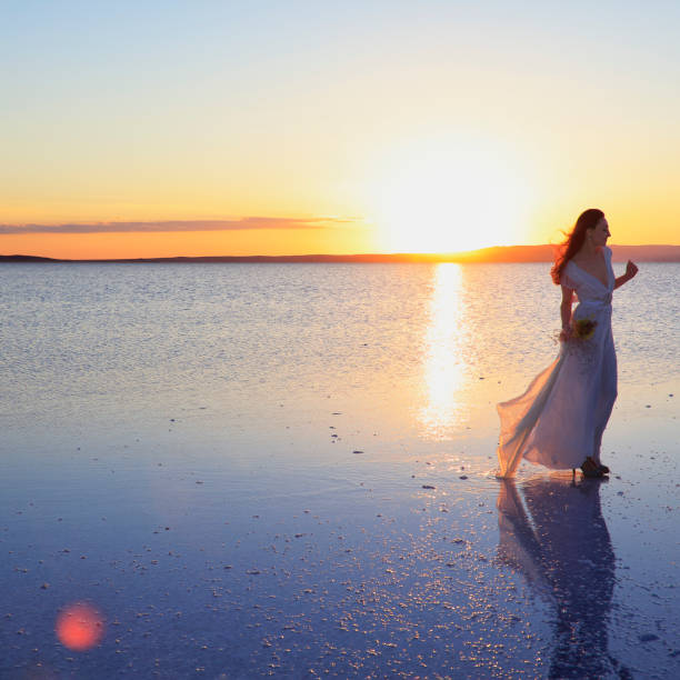 istock Bride holding the flower in Salt lake, Turkey 829547724