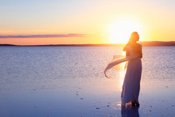 istock Bride holding the flower in Salt lake, Turkey 829547810