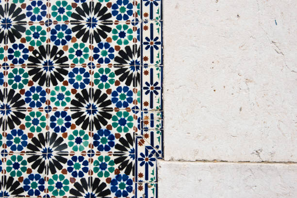 istock Beautiful colourful half Portuguese tile, half concrete wall, horizontal photo 829548706