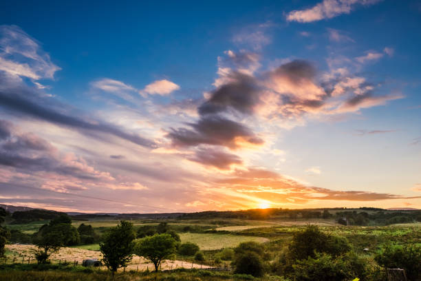 istock Dramatic sunset sky behind a green summer landscape with hills in Wales, Brecon Beacons National Park 829555434