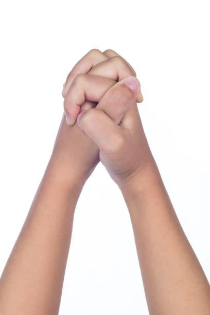 istock Child's hands folded together in prayer 829562310