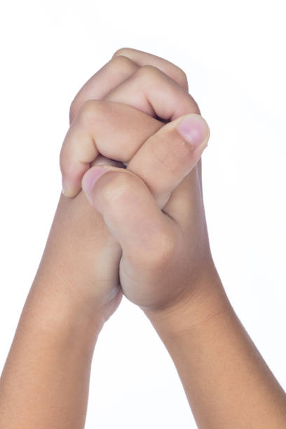 istock Child's hands folded together in prayer 829562334