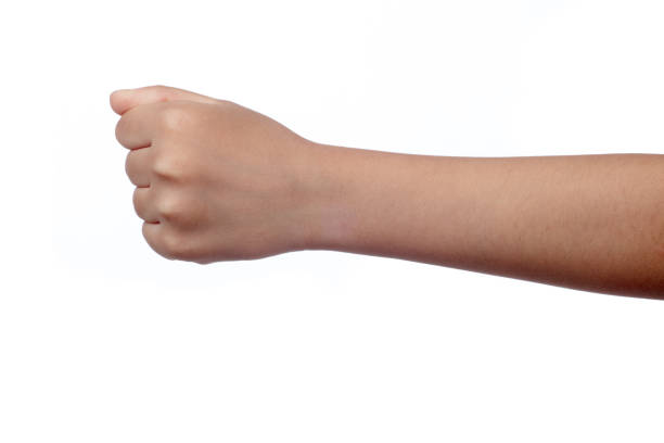 Close up of a child's clenched fist Close up of a child's clenched fist in isolated white background knuckle joint stock pictures, royalty-free photos & images