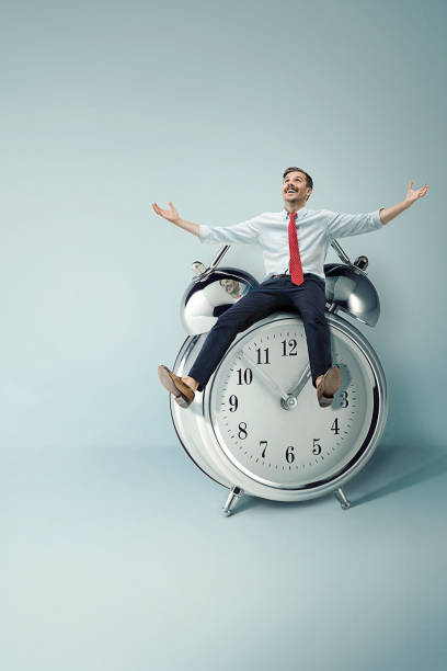 istock Collage of businessman with clock on white 829562406