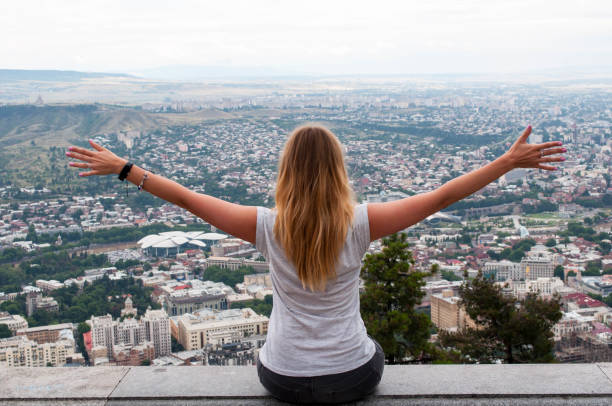 istock Girl looks at the city 829565018