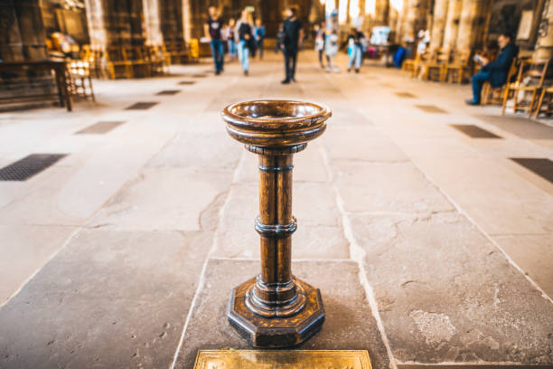 Baptismal font A wooden baptismal font inside a church baptismal font stock pictures, royalty-free photos & images