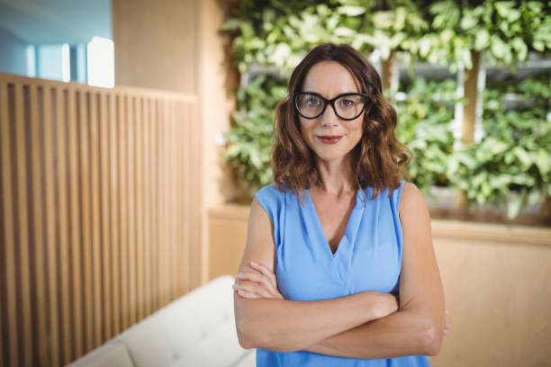 istock Portrait of executive standing with arms crossed 829580382