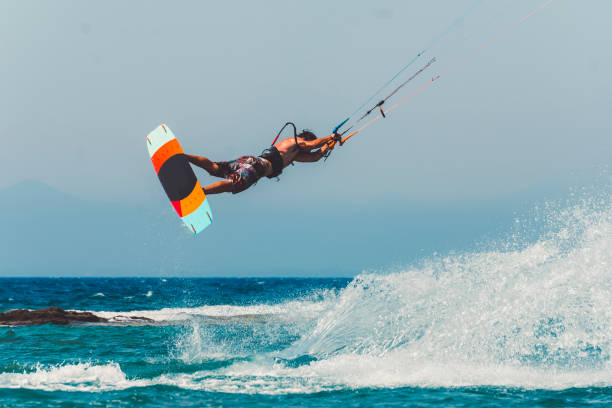 istock Kiteboard instructor showing off his skills 829582484