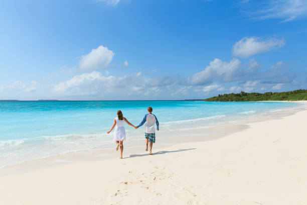 istock happy loving couple enjoy tropical beach 829590012