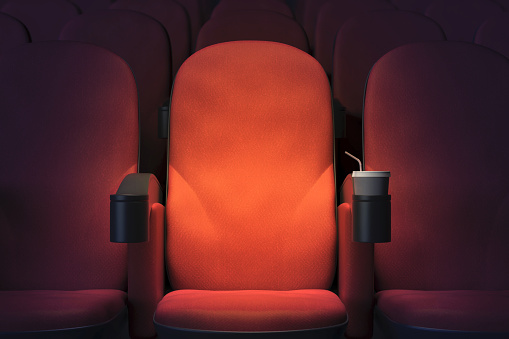 Close up of empty red cinema or theater armchair. Mock up, 3D Rendering