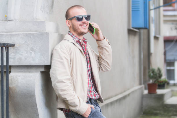 istock Urban guy talking on the phone outdoors. 829592042