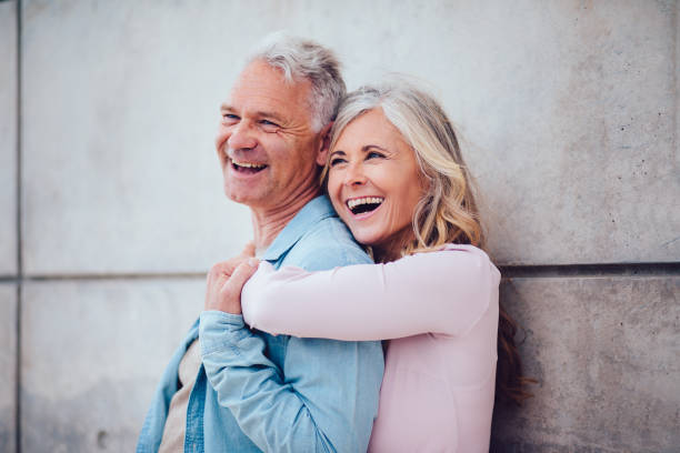 istock Romantic senior married couple laughing and having fun together 829598808