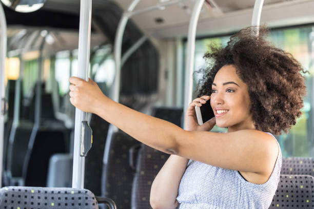 istock Cheerful woman using smart phone in bus 829610746