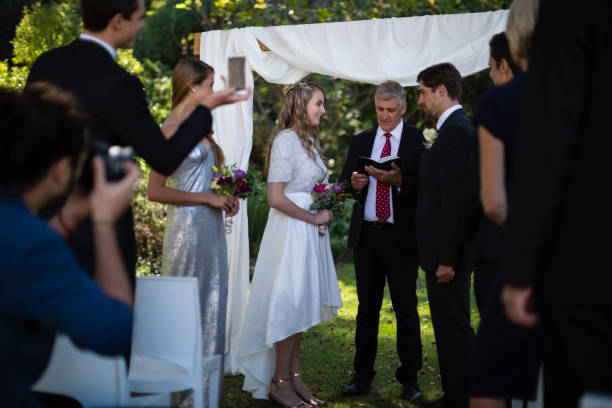istock Minister giving speech to bride and groom 829617758