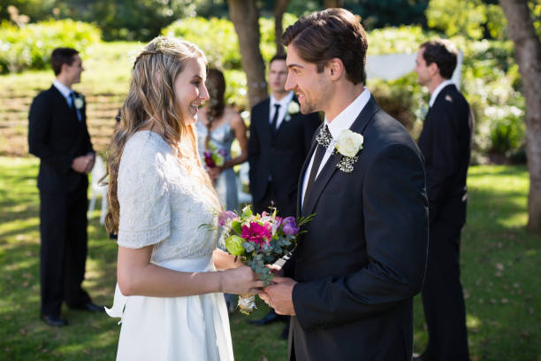 istock Bride and groom interacting with each other 829619544
