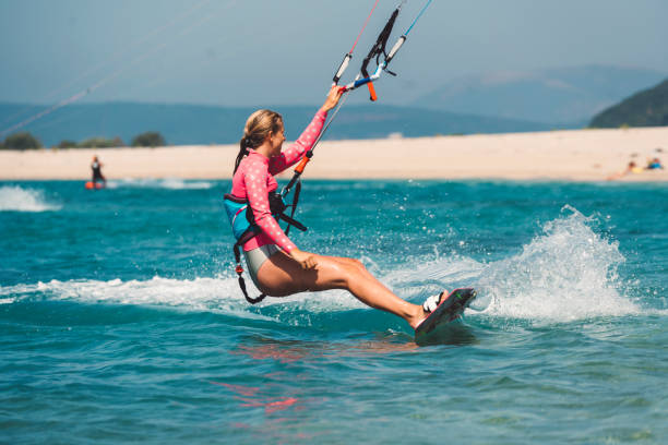 istock Kite surfer beginner in the water 829624828