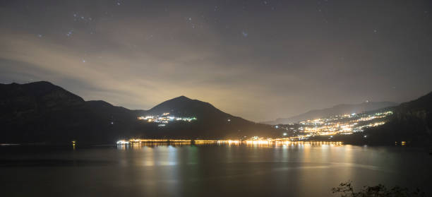 View of a village on Lake Iseo at night.