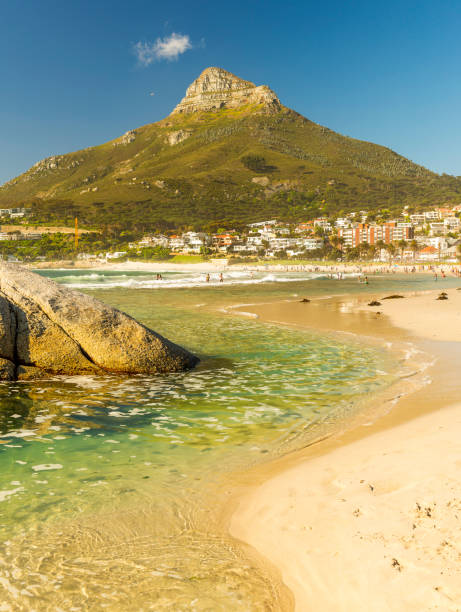 camps bay beach in cape town, south africa - cape town beach crowd people imagens e fotografias de stock