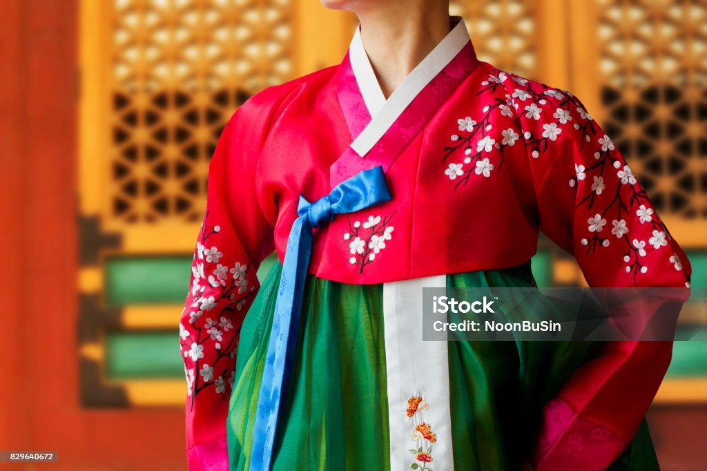 The woman wearing colorful Hanbok, Korean traditional dress in the Deoksugung Palace. Hanbok, Korean traditional silk dress., Holiday backgrounds, red, green, colorful, thanksgiving, embroidery, Deoksugung Palace. Hanbok Stock Photo