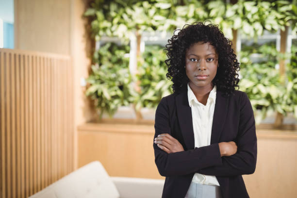 istock Portrait of executive standing with arms crossed 829641932