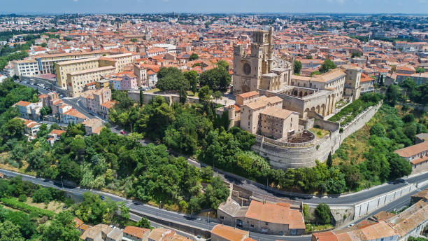 Aerial top view of Beziers town architecture and cathedral from above, South France Aerial top view of Beziers town architecture and cathedral from above, South France beziers stock pictures, royalty-free photos & images