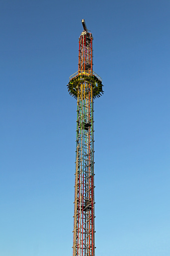 Drop tower free fall ride in amusement park