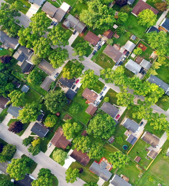 istock Looking straight down on nice Neighborhood on Summer morning. 829662786