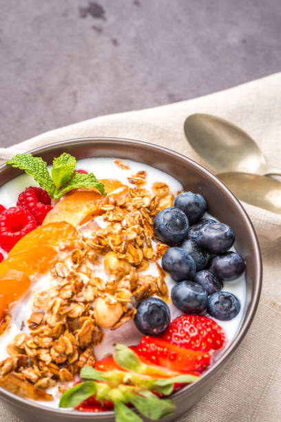 istock Yogurt with baked granola and berries 829668452
