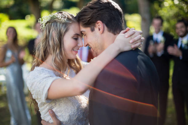 istock Affectionate couple embracing each other in park 829669546