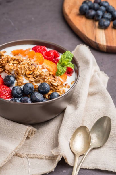 istock Yogurt with baked granola and berries 829669890