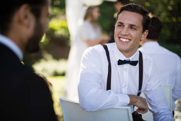 istock Waiter interacting with man in park 829679516