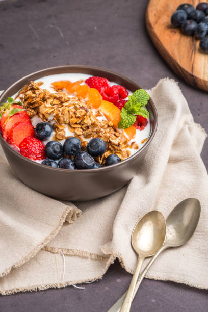 istock Yogurt with baked granola and berries 829690428