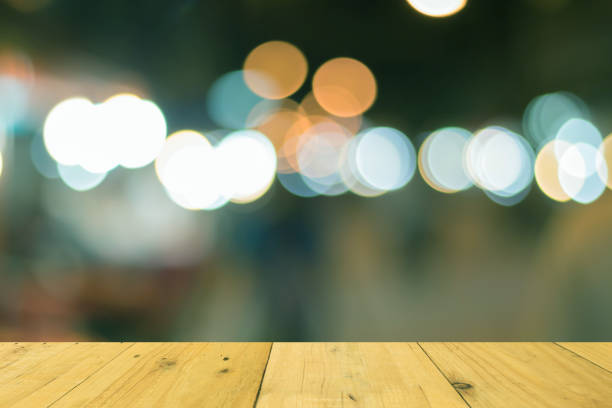 istock Brown wooden table on front and blurred background. textured 829692124