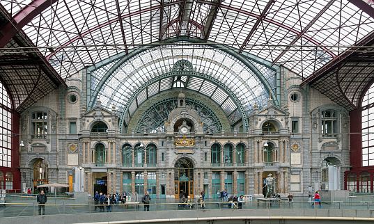 Antwerp, Belgium - May 24, 2013: Internal facade of Antwerpen-Centraal (Antwerp Central railway station). The station building was constructed in 1895-1905 by design of the Belgian architect Louis Delacenserie. In 2014 the British-American magazine Mashable awarded Antwerpen-Centraal the first place for the most beautiful railway station in the world.
