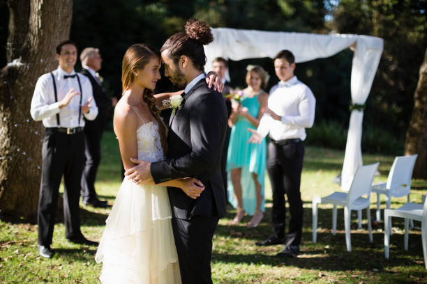 istock Affectionate couple embracing each other in park 829715618