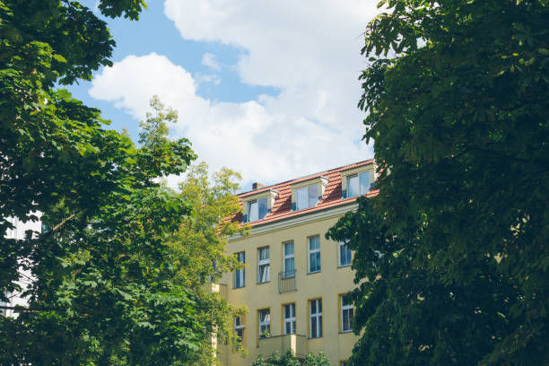 istock old facade of building in berlin framed by green enviroment trees 829727298