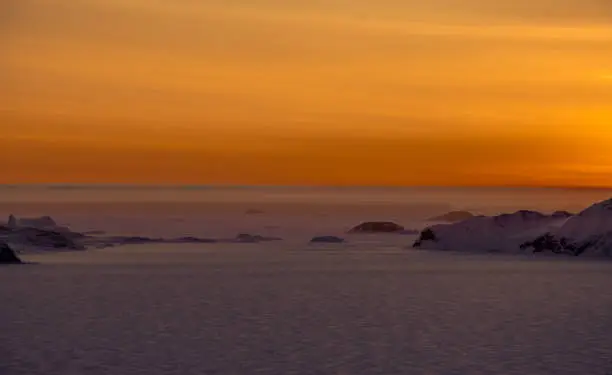 These pictures were taken at Larsemann hills at antarctica on 07-11-2017. The clear skies and the pure clarity of sky is really awesome. This picture was taken after the end of polar nights at Antarctica. There was visible mirage phenomenon and a minute view of the sun just peeping above the horizon.