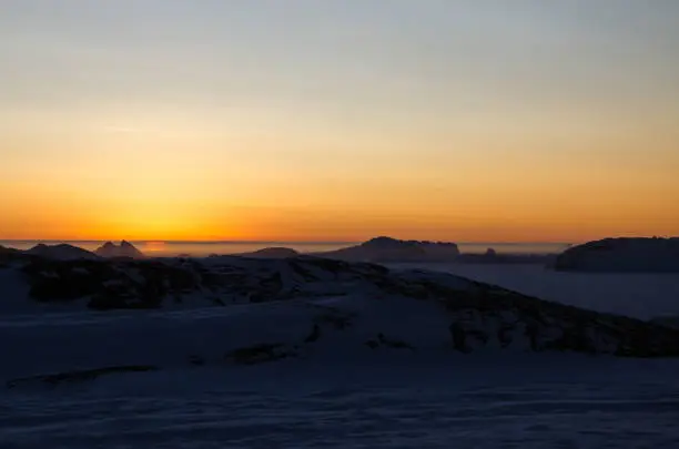 These pictures were taken at Larsemann hills at antarctica on 07-11-2017. The clear skies and the pure clarity of sky is really awesome. This picture was taken after the end of polar nights at Antarctica. There was visible mirage phenomenon and a minute view of the sun just peeping above the horizon.