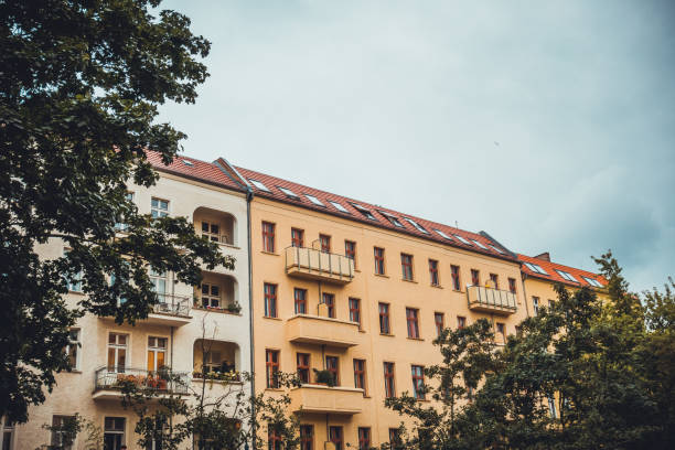 istock white and orange apartment buildings on a cloudy day 829756562