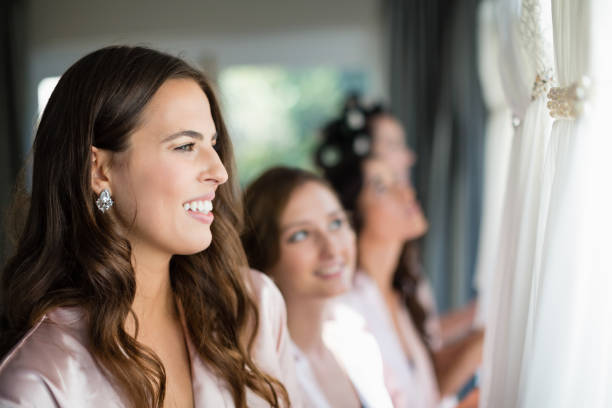 istock Smiling women looking at wedding dress 829758166