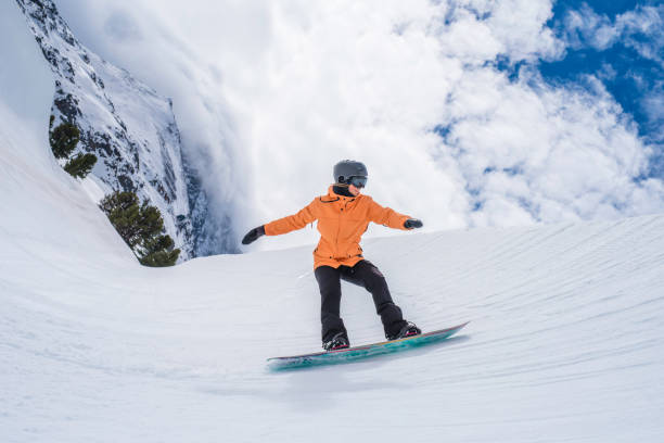 Female snowboarder in half pipe