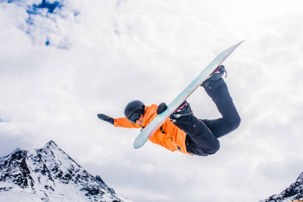 Female snowboarder in mid air