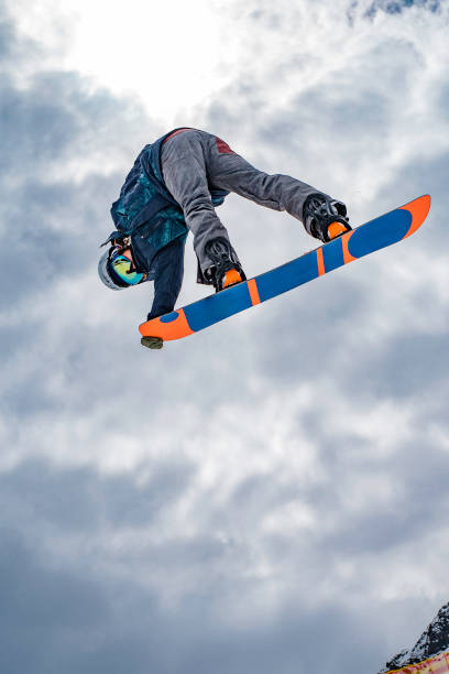 istock Male snowboarder in mid air 829764898
