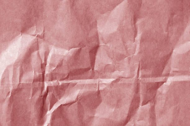 istock Red color paper sheet surface with wrinckles. 829765168