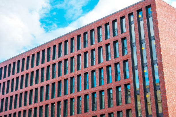istock finance building with red brick facade and hundreds of small windows 829767916