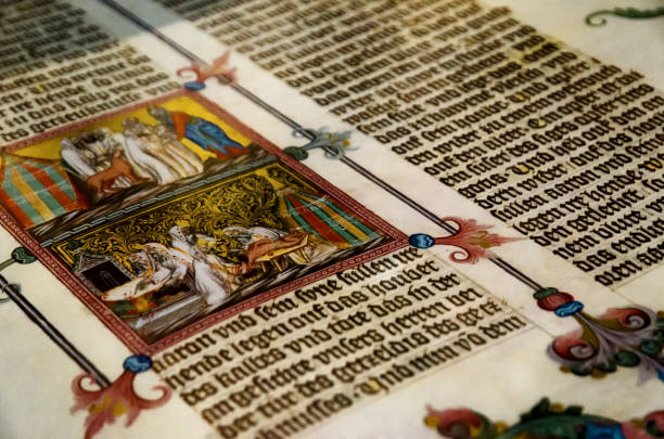 Vienna, Austria - May 20, 2017: An ancient tome with miniature illustration, open inside a display case of the Austrian National Library, famous historic library of Vienna, on may 20, 2017