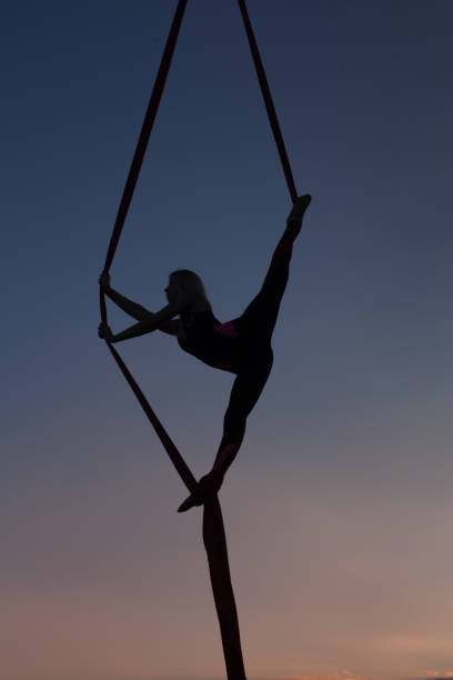 istock Female silhouette during an aktobatichesky nomar. 829778622